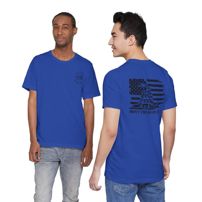 Two people wearing blue t-shirts with a front and back design on a white background