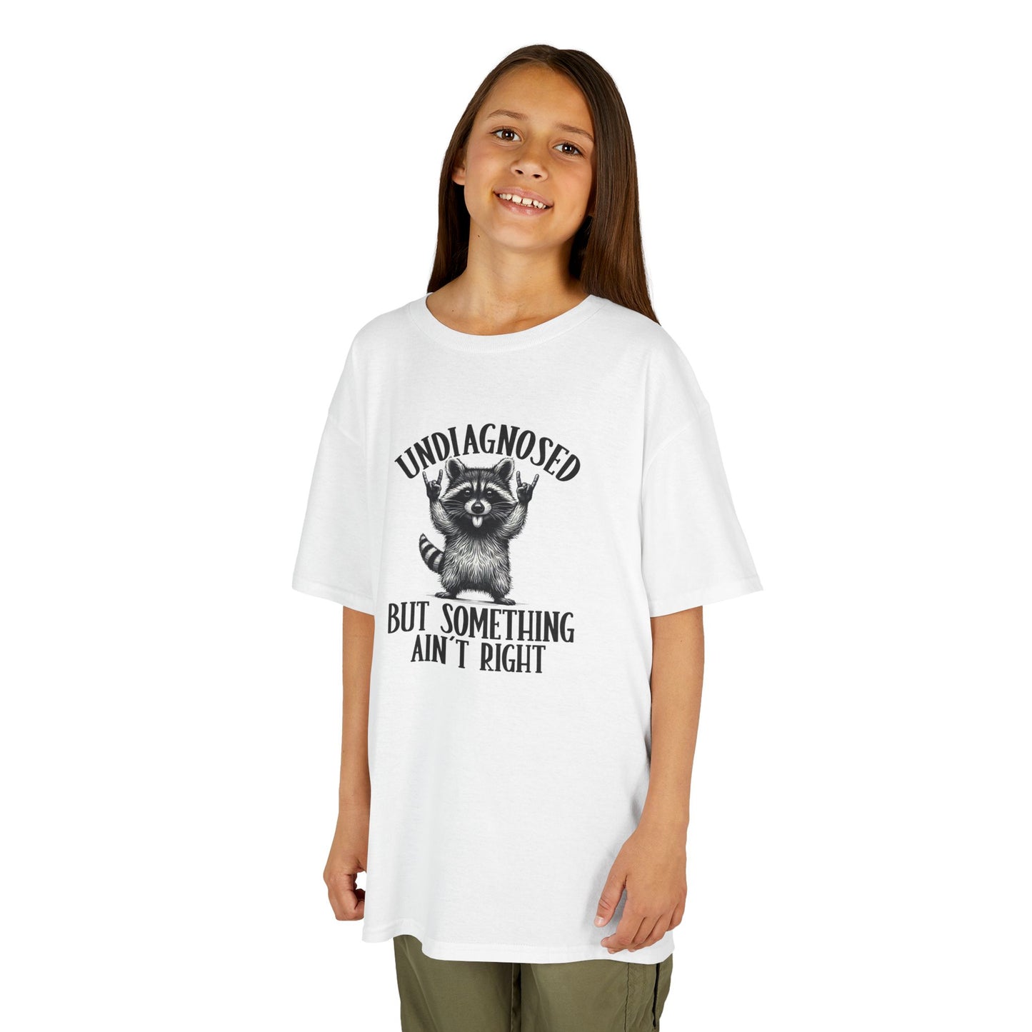 Young girl wearing a white t-shirt with a graphic design on a white background