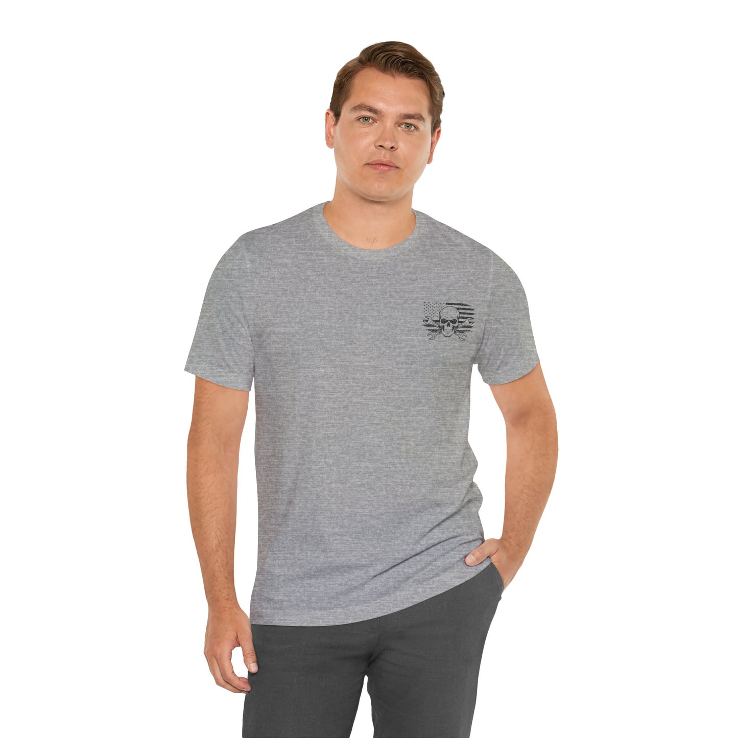 Man wearing a gray t-shirt with a small logo on a white background