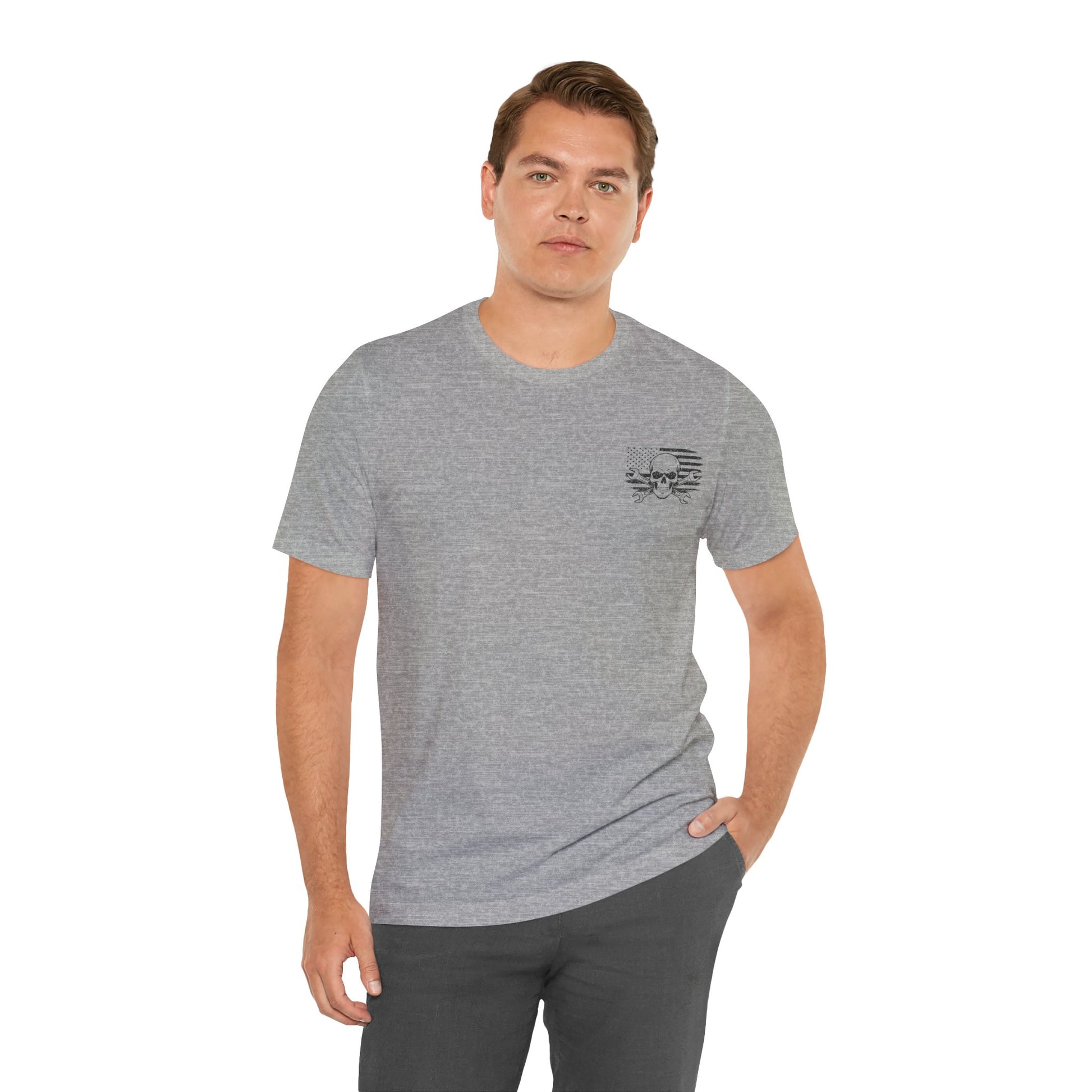 Man wearing a gray t-shirt with a small logo on a white background
