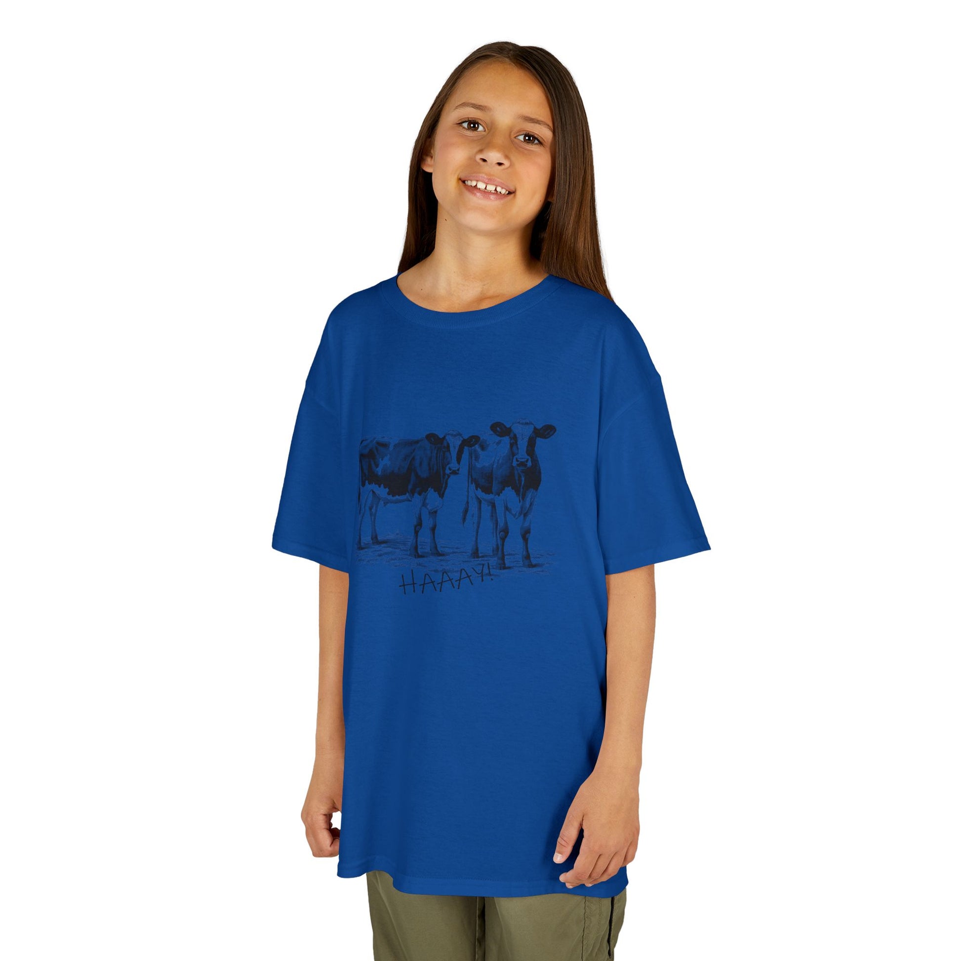 Child wearing a blue t-shirt with a graphic design on a white background