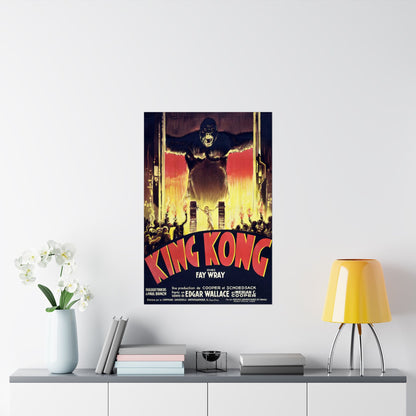 King Kong movie poster on a wall above a shelf with decor items.
