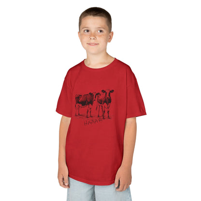 Child wearing a red t-shirt with cow design on a white background