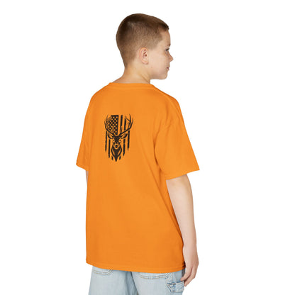 Person wearing an orange t-shirt with a black graphic design on the back, standing against a white background