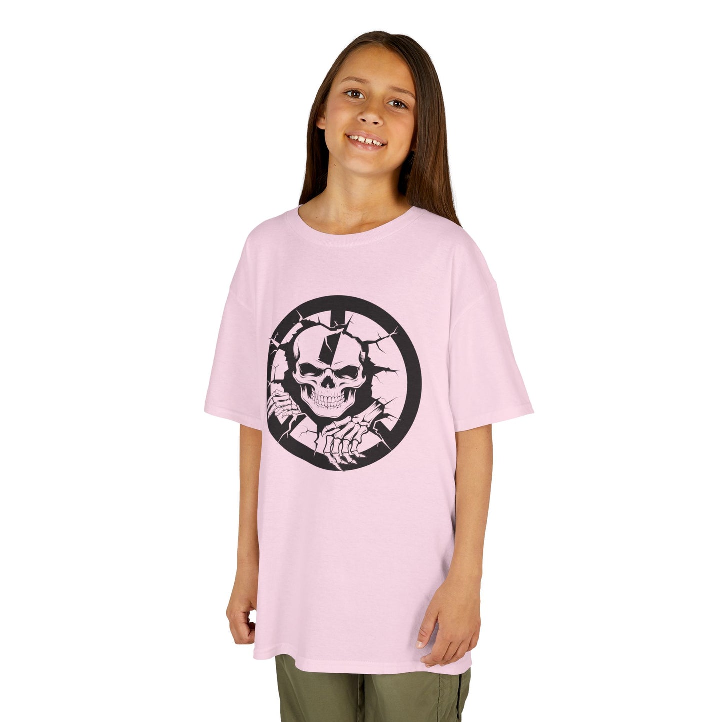 Young girl wearing a pink t-shirt with a black and white graphic design on a white background