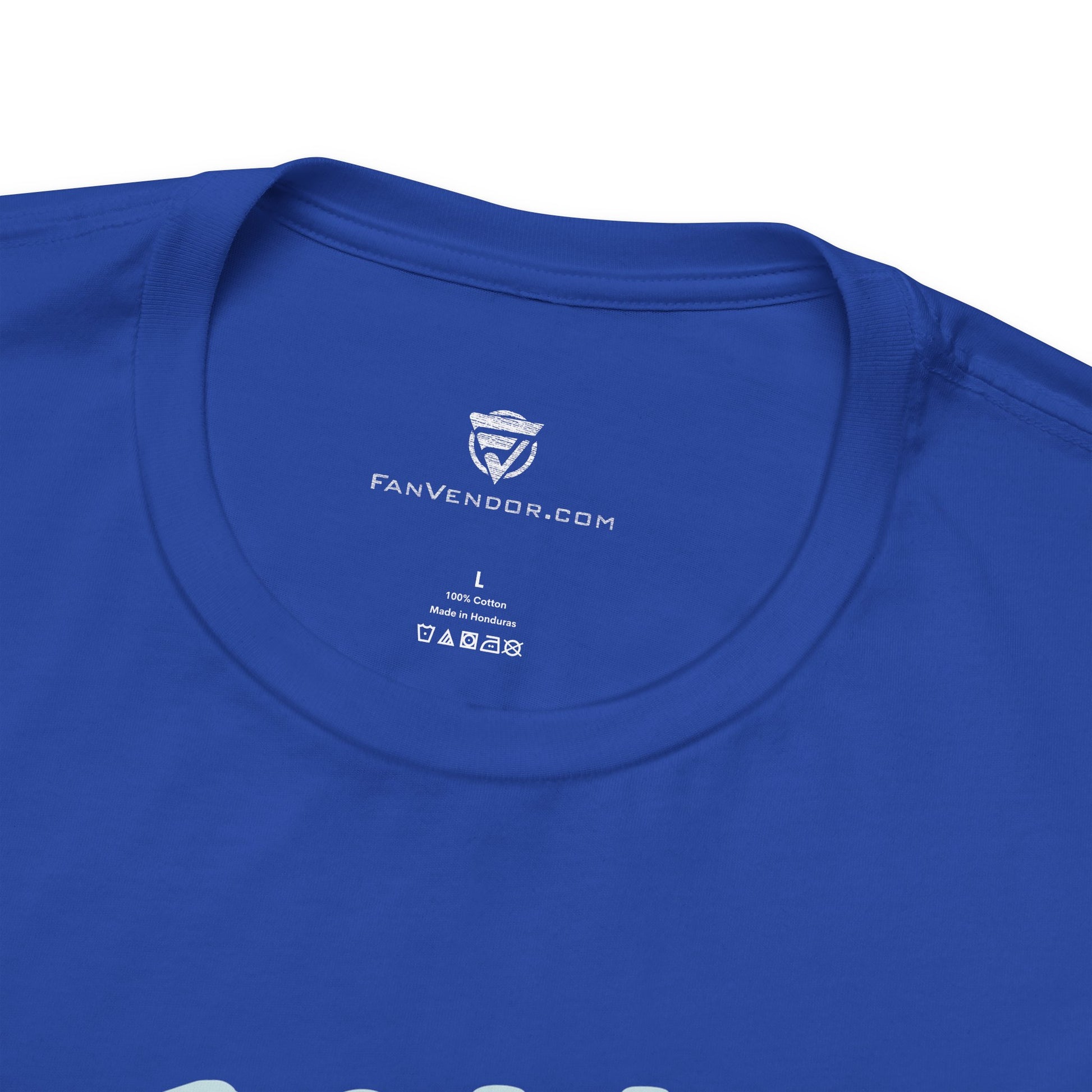 Close-up of a blue t-shirt with 'Fanvendor.com' logo on the collar.