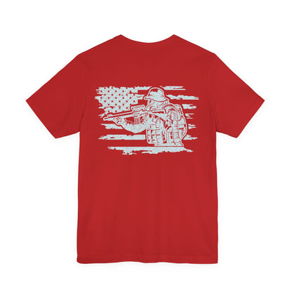 Red t-shirt with white graphic of a soldier holding a rifle on a white background