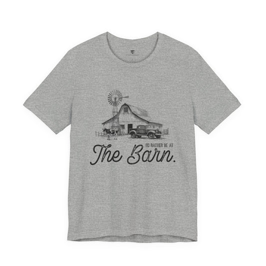 Gray t-shirt with a graphic of a barn and truck, and text 'I'd rather be at The Barn'