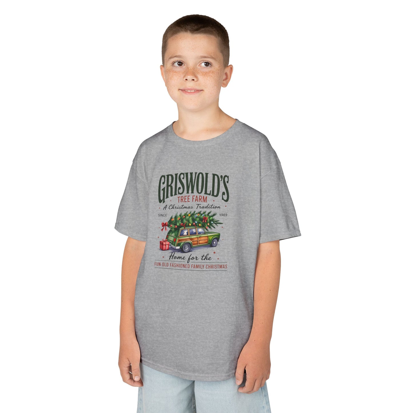 Child wearing a gray t-shirt with graphic on a white background