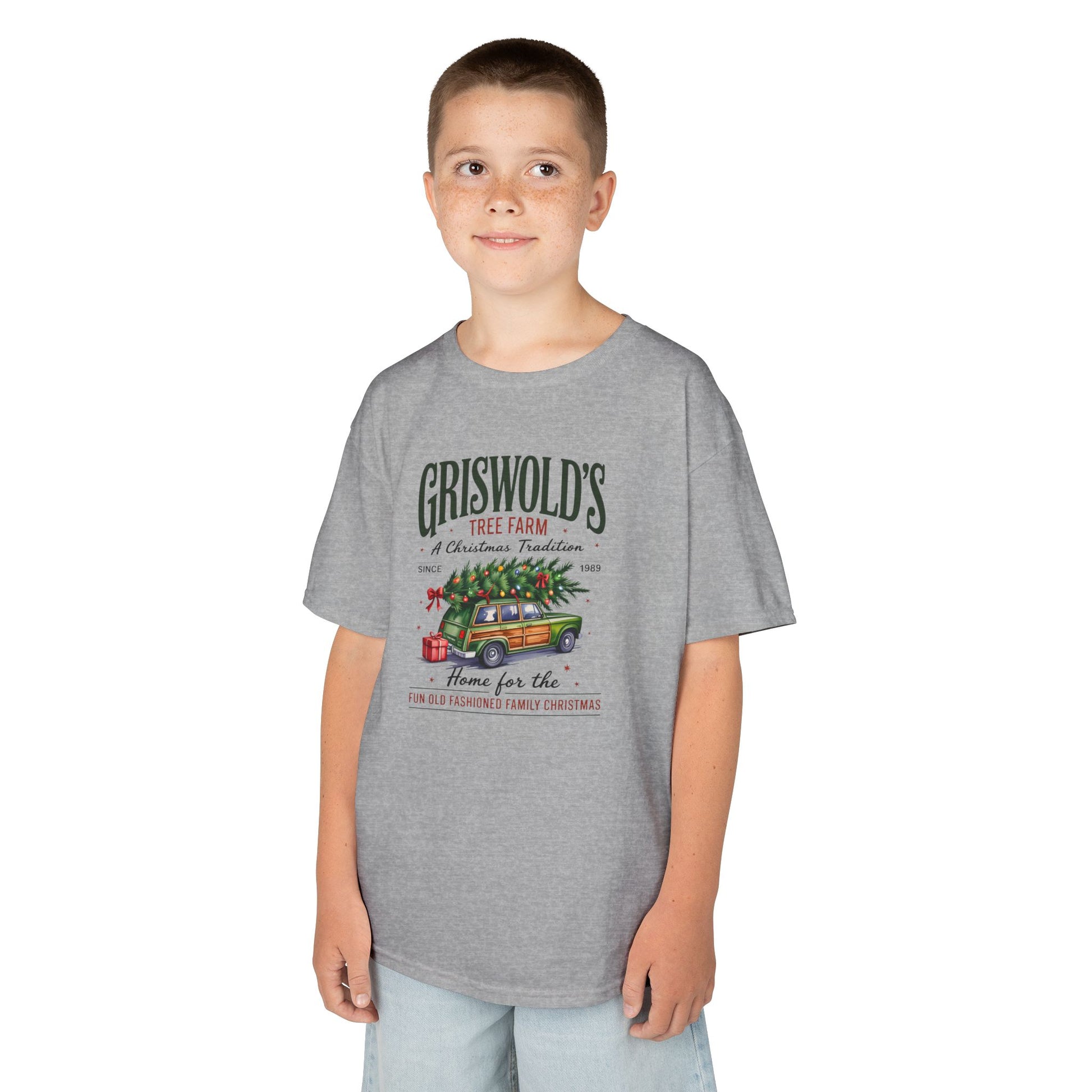 Child wearing a gray t-shirt with graphic on a white background