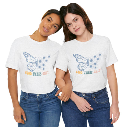 Two women wearing matching t-shirts with text and graphics on a white background.