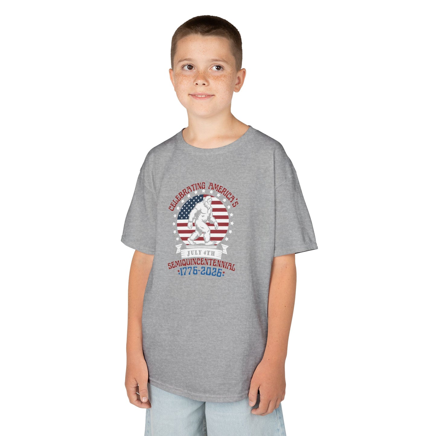 Child wearing a gray t-shirt with a graphic design on a white background