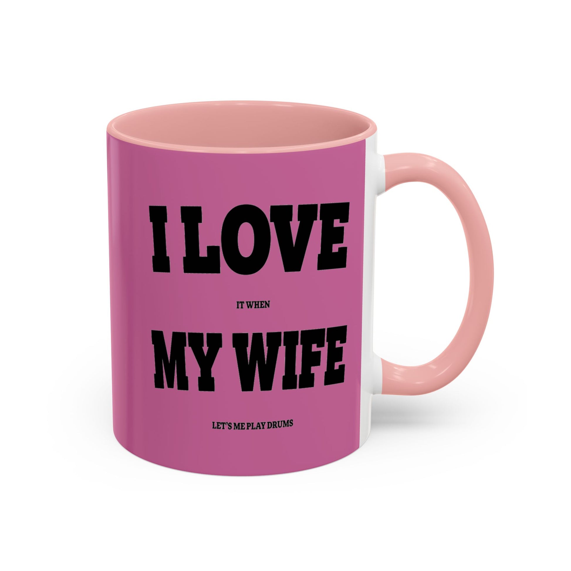 Pink mug with black text on a white background