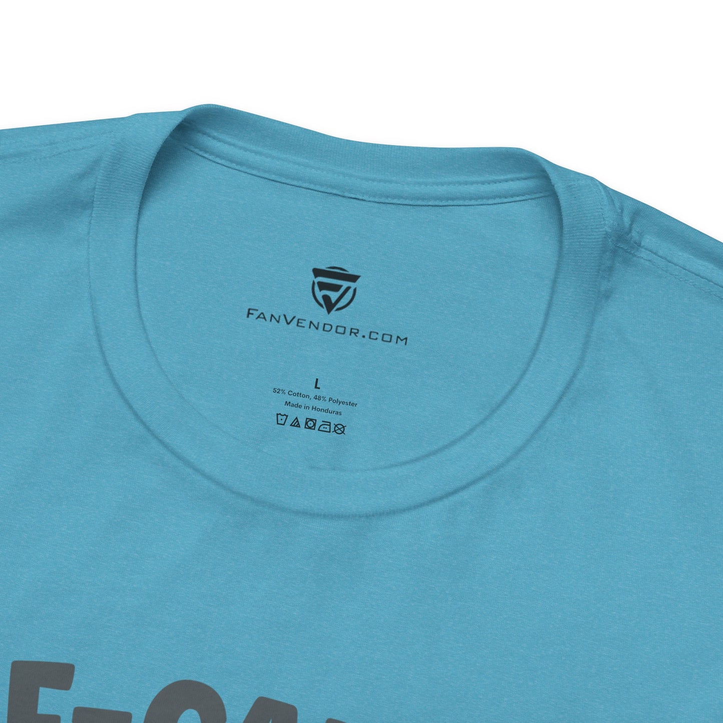 Close-up of a blue t-shirt with 'FanVendor.com' logo and text 