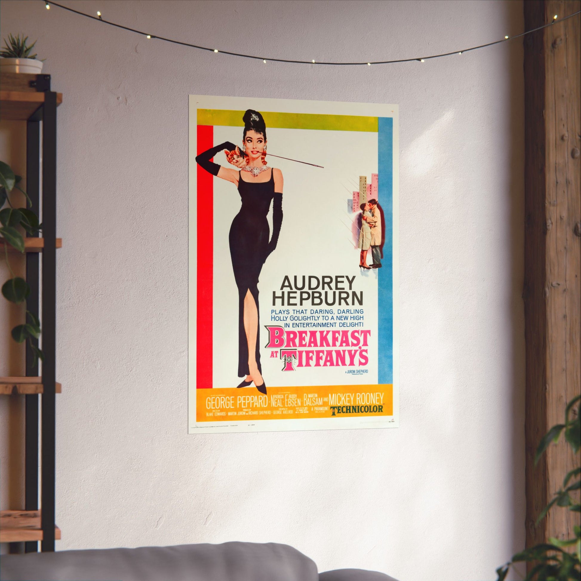 Movie poster for 'Breakfast at Tiffany's' featuring Audrey Hepburn on a wall.