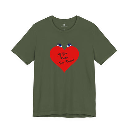 Green t-shirt with red and white text on a white background