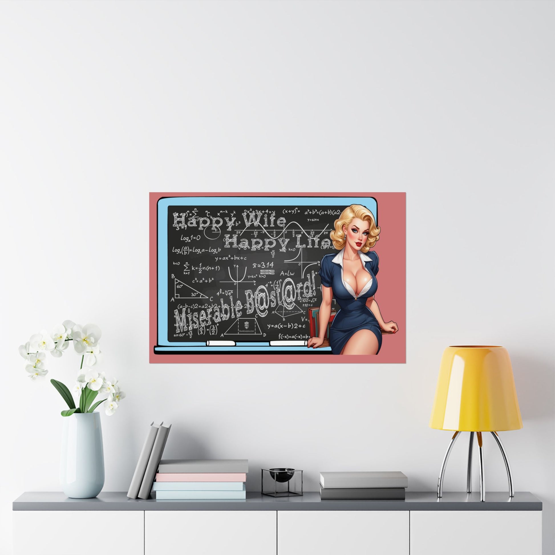 A framed wall art print featuring a retro pin-up woman beside a chalkboard with the words displayed in a styled room above a console table with books, a lamp, and flowers.
