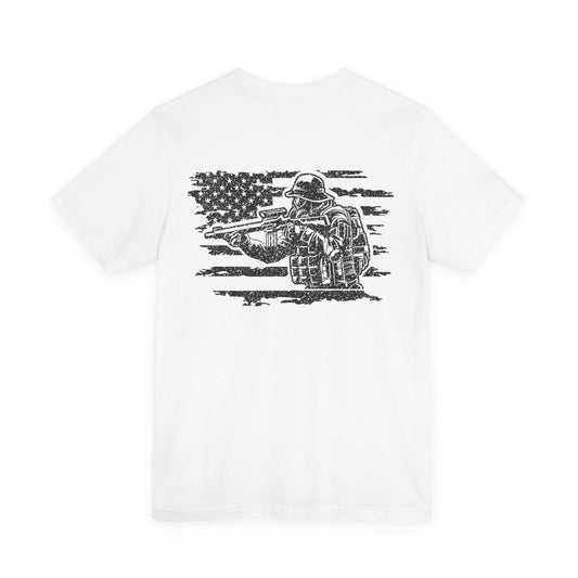 White t-shirt with black graphic of a soldier holding a rifle and an American flag on a white background