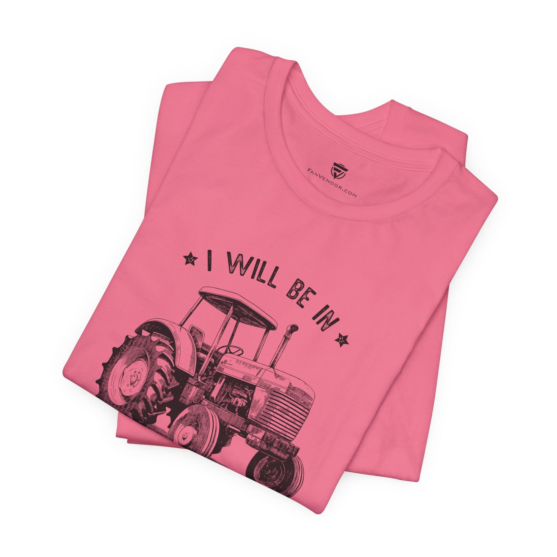 Pink t-shirt with tractor graphic and text 
