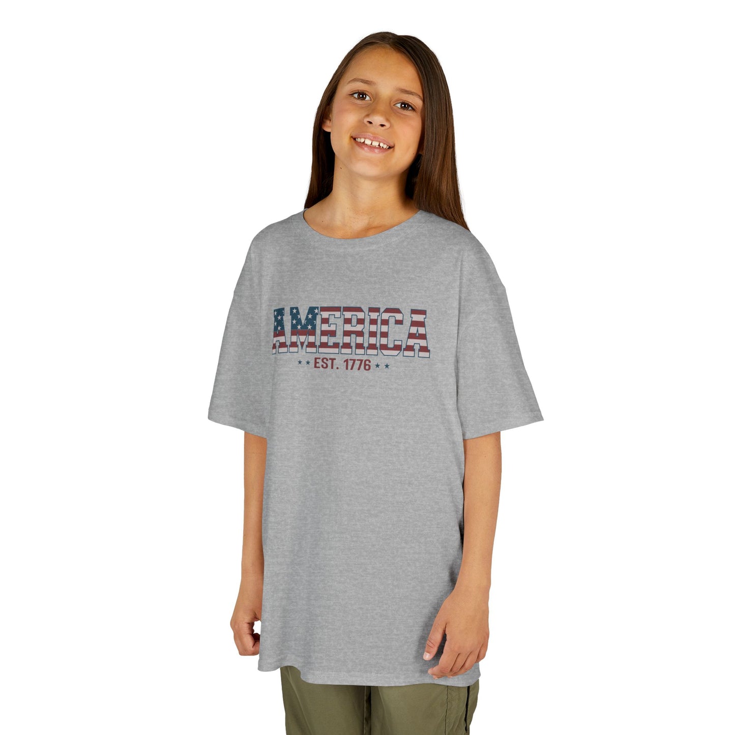 Child wearing a gray t-shirt with text on a white background