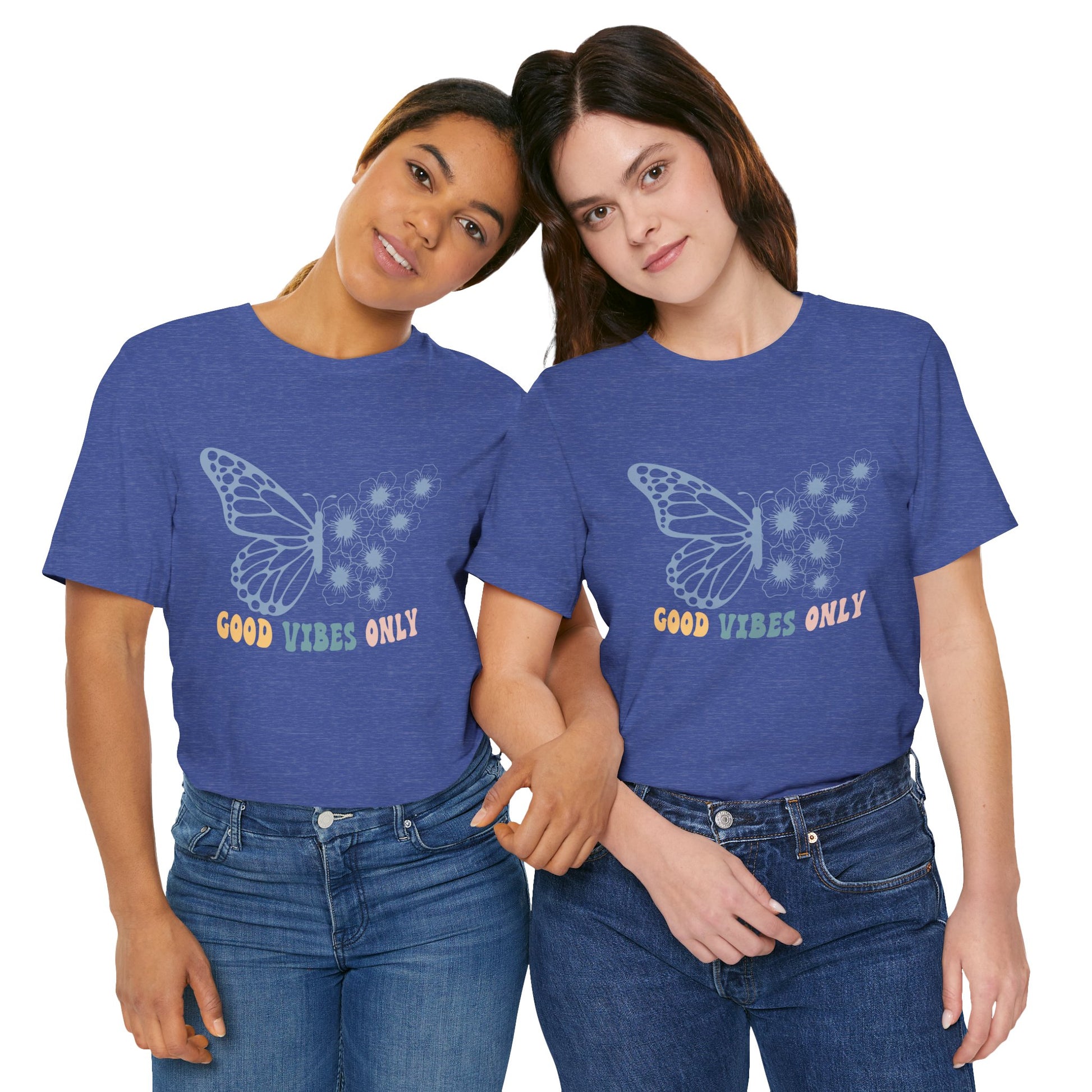 Two people wearing blue t-shirts with a butterfly design and text.