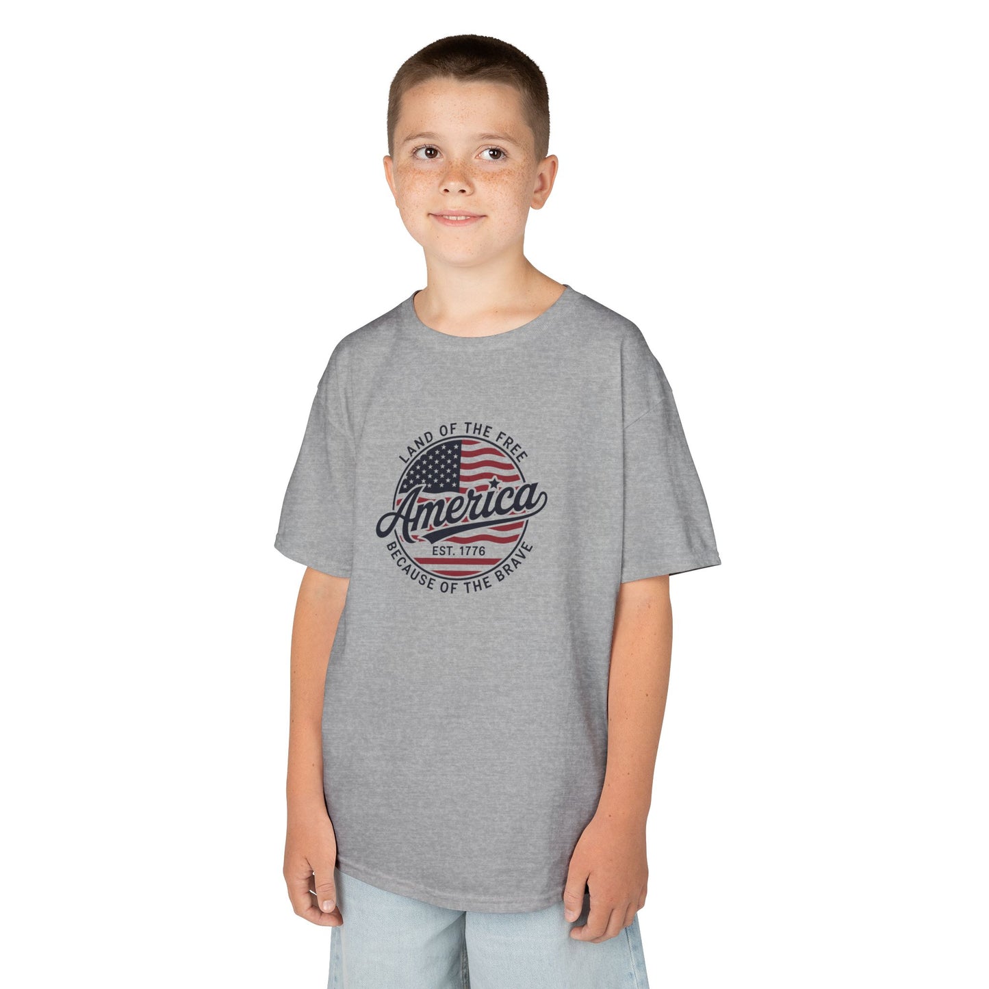 Child wearing a gray t-shirt with an American flag design on a white background