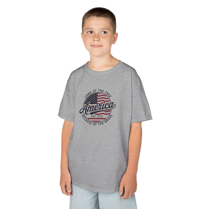 Child wearing a gray t-shirt with an American flag design on a white background