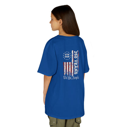 Person wearing a blue t-shirt with a design on the back, standing against a white background
