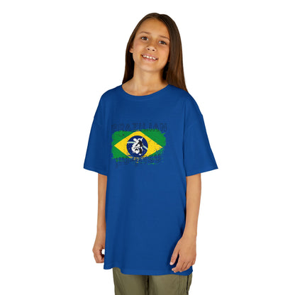 Child wearing a blue t-shirt with a graphic design on a white background