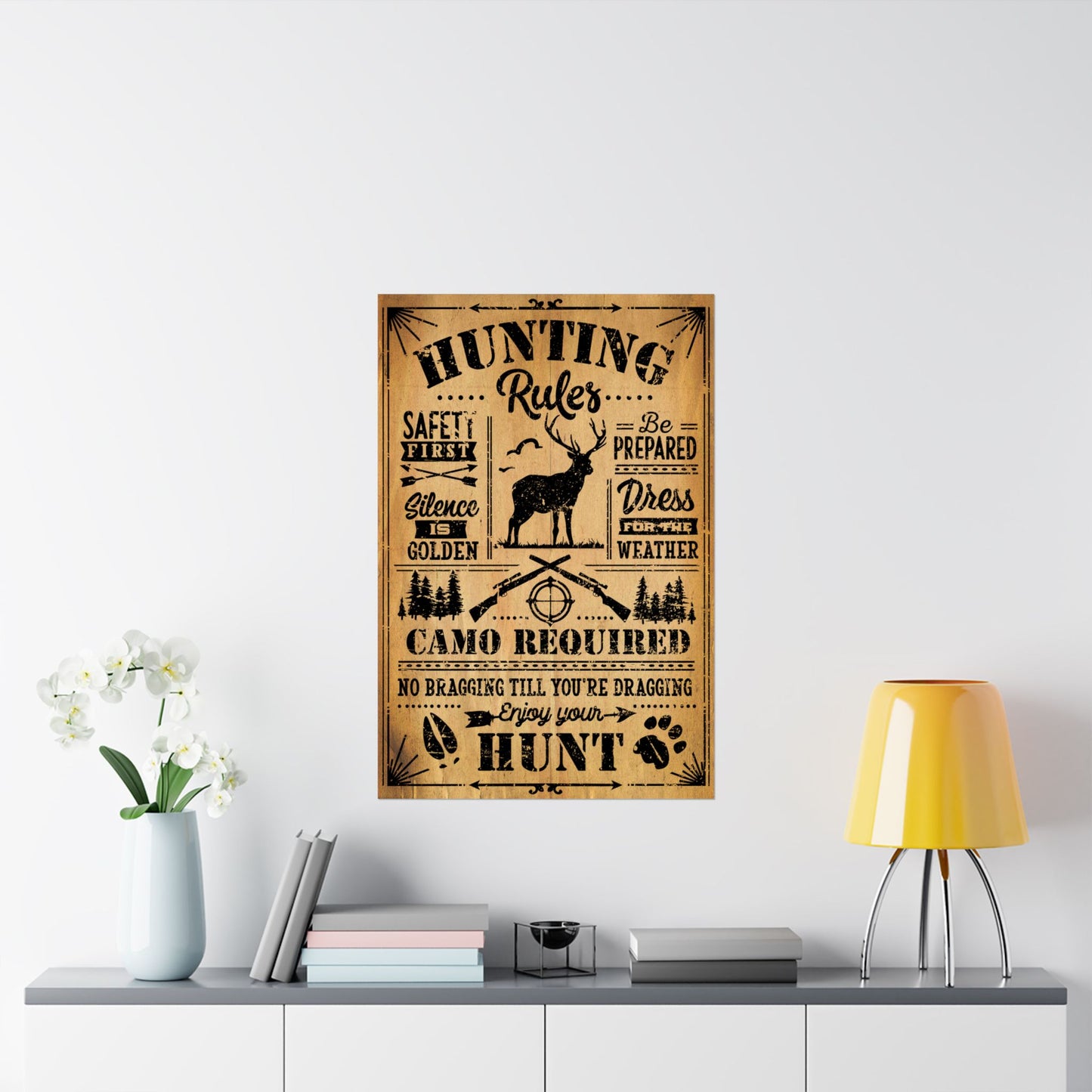 Hunting rules poster on a wall above a shelf with decor items.