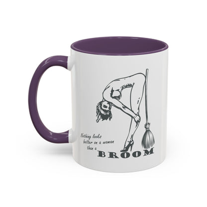 Mug with a graphic of a woman holding a broom and text on a white background