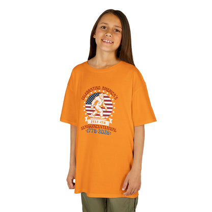Child wearing an orange t-shirt with a graphic design on a white background