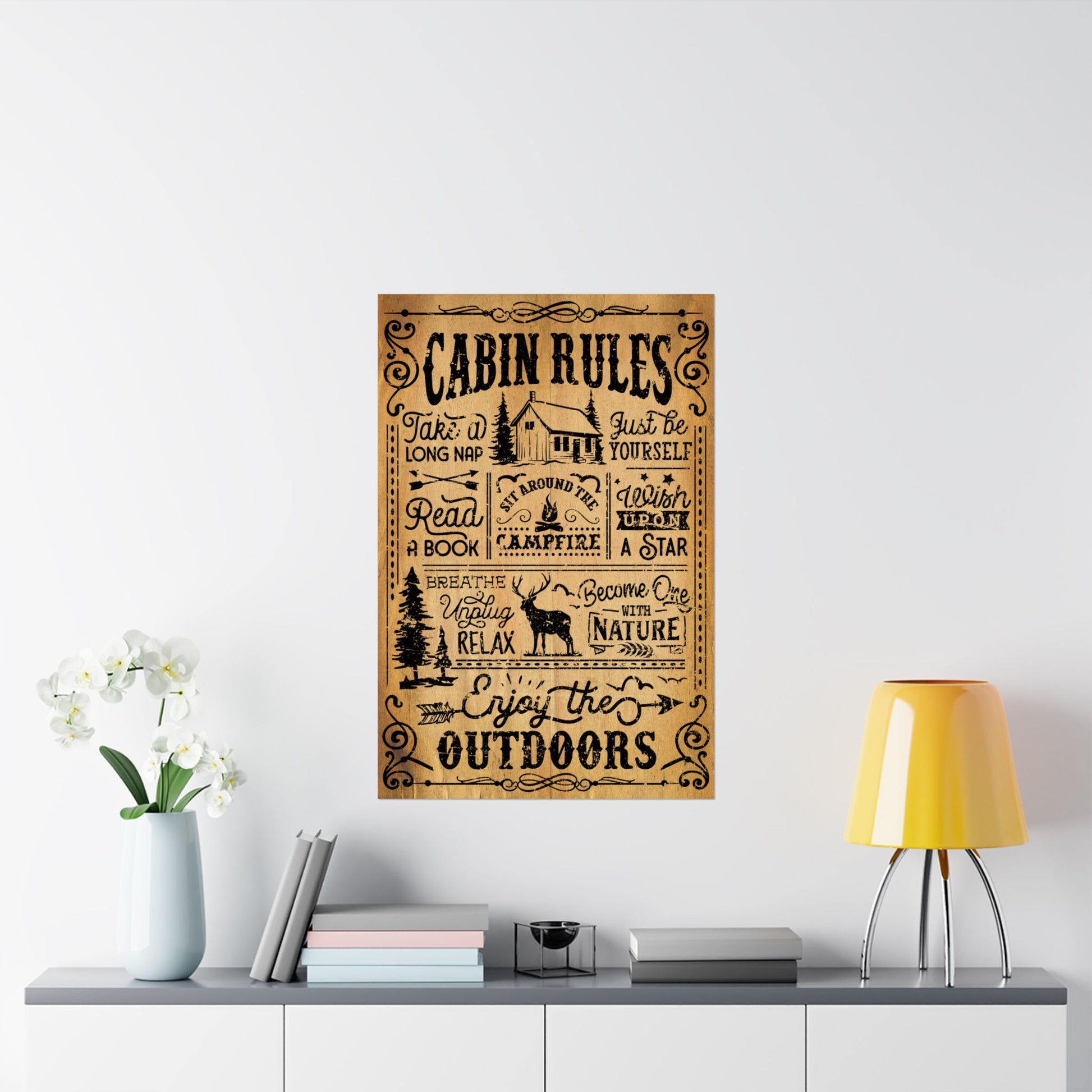 Wooden sign with 'Cabin Rules' text on a wall above a shelf with decor items.