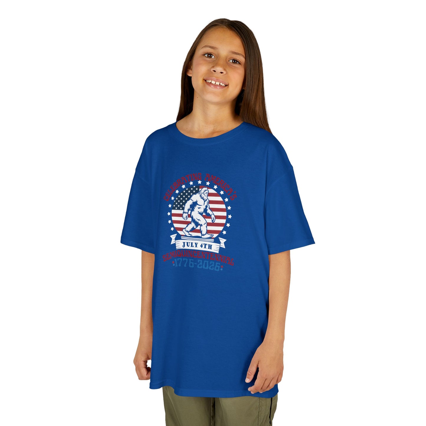 Child wearing a blue t-shirt with a graphic design on a white background