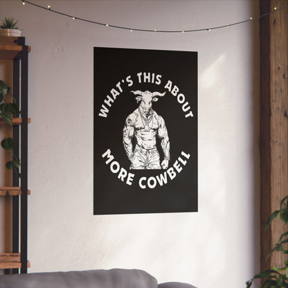 Poster with a graphic of a muscular figure and text 'What's This About More Cowbell' on a wall.