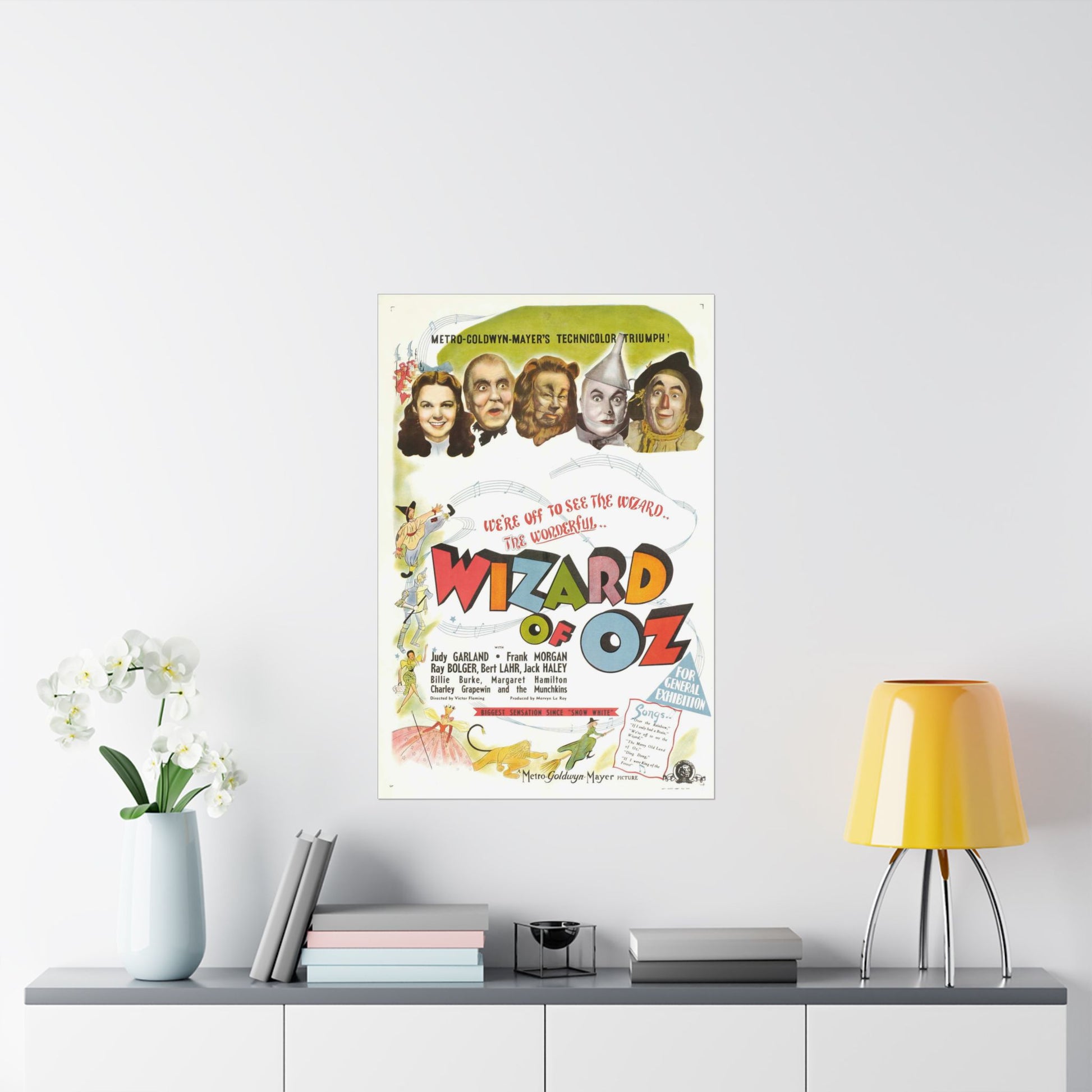 Poster of 'The Wizard of Oz' on a wall above a shelf with decor items.