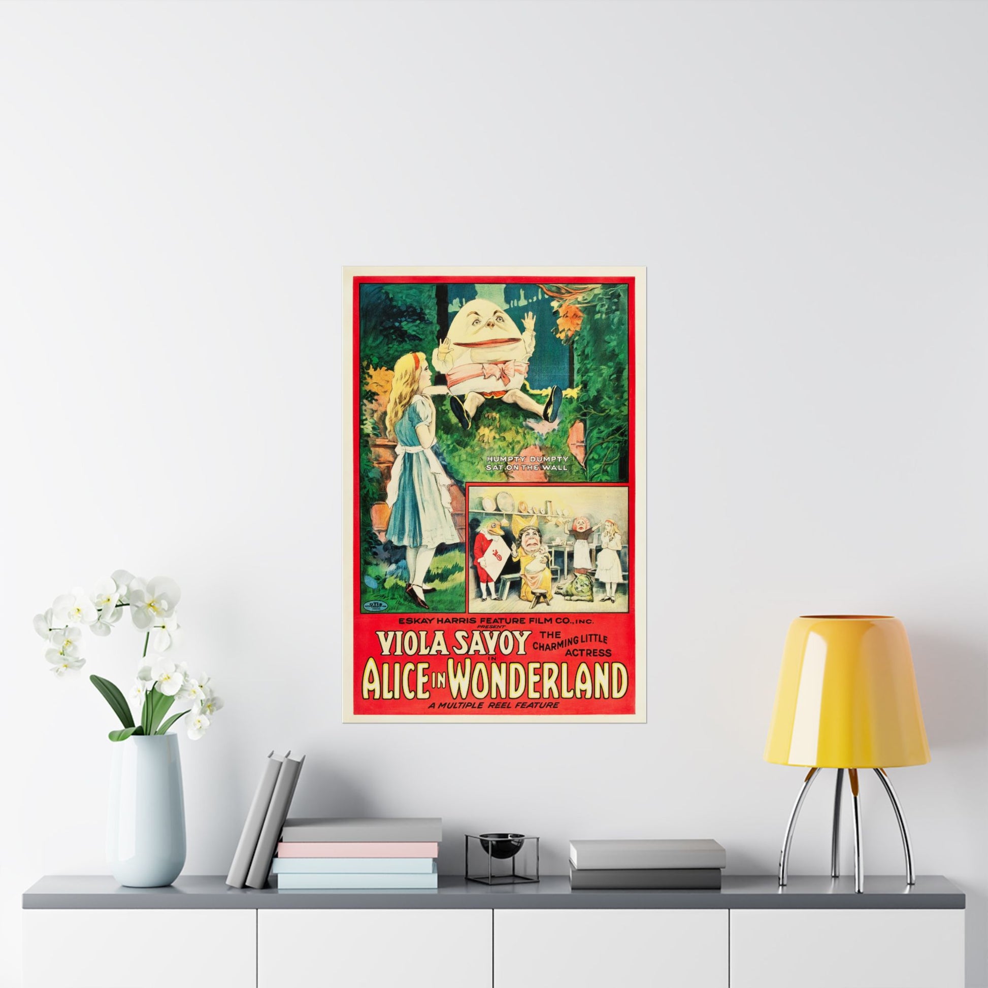 Vintage-style poster of 'Alice in Wonderland' on a wall above a shelf with decor items.