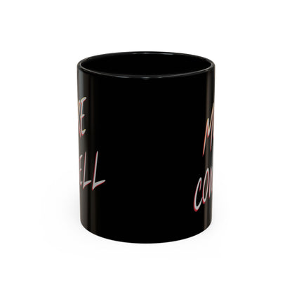 Black mug with pink text on a white background