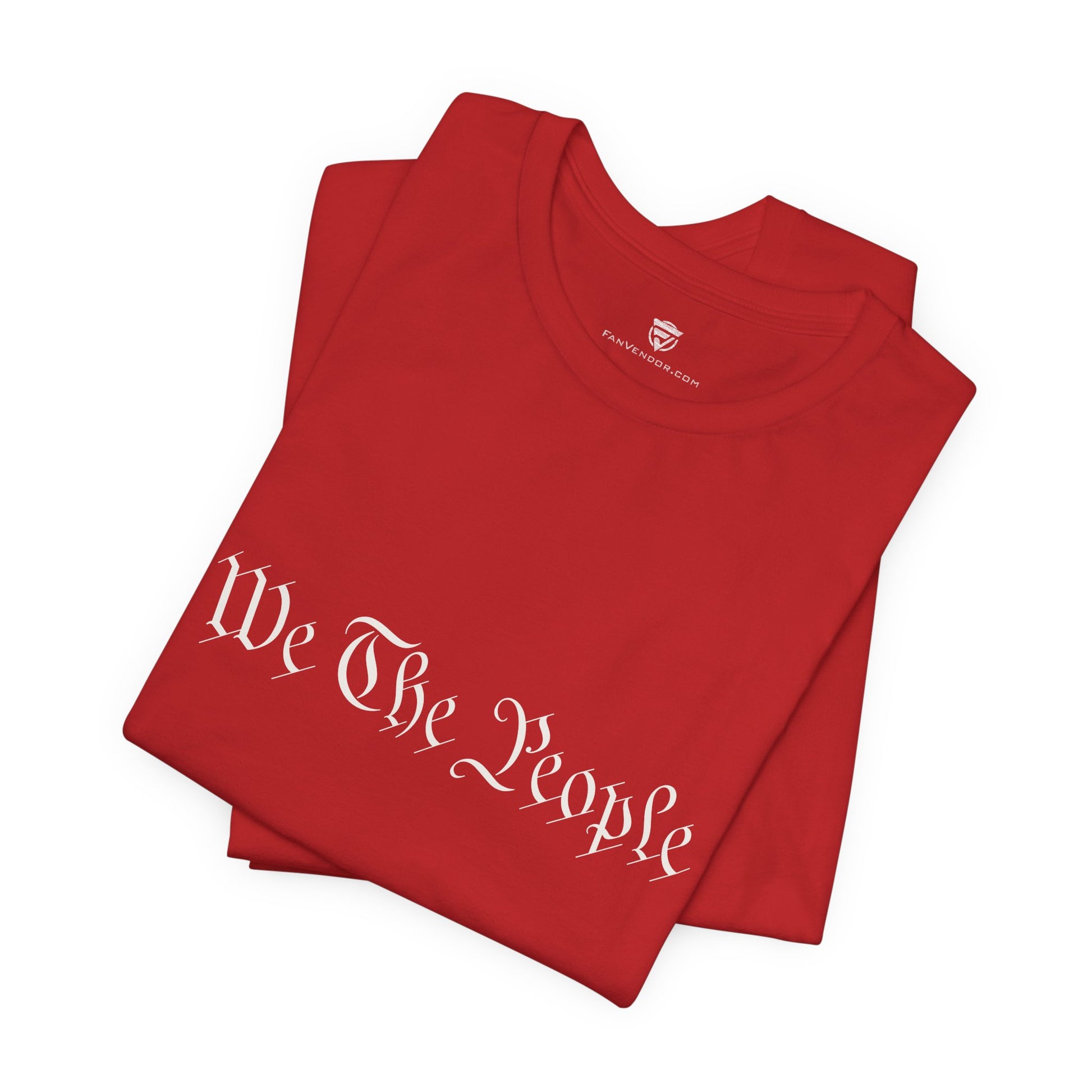 Folded red t-shirt with 'We The People' text on a white background