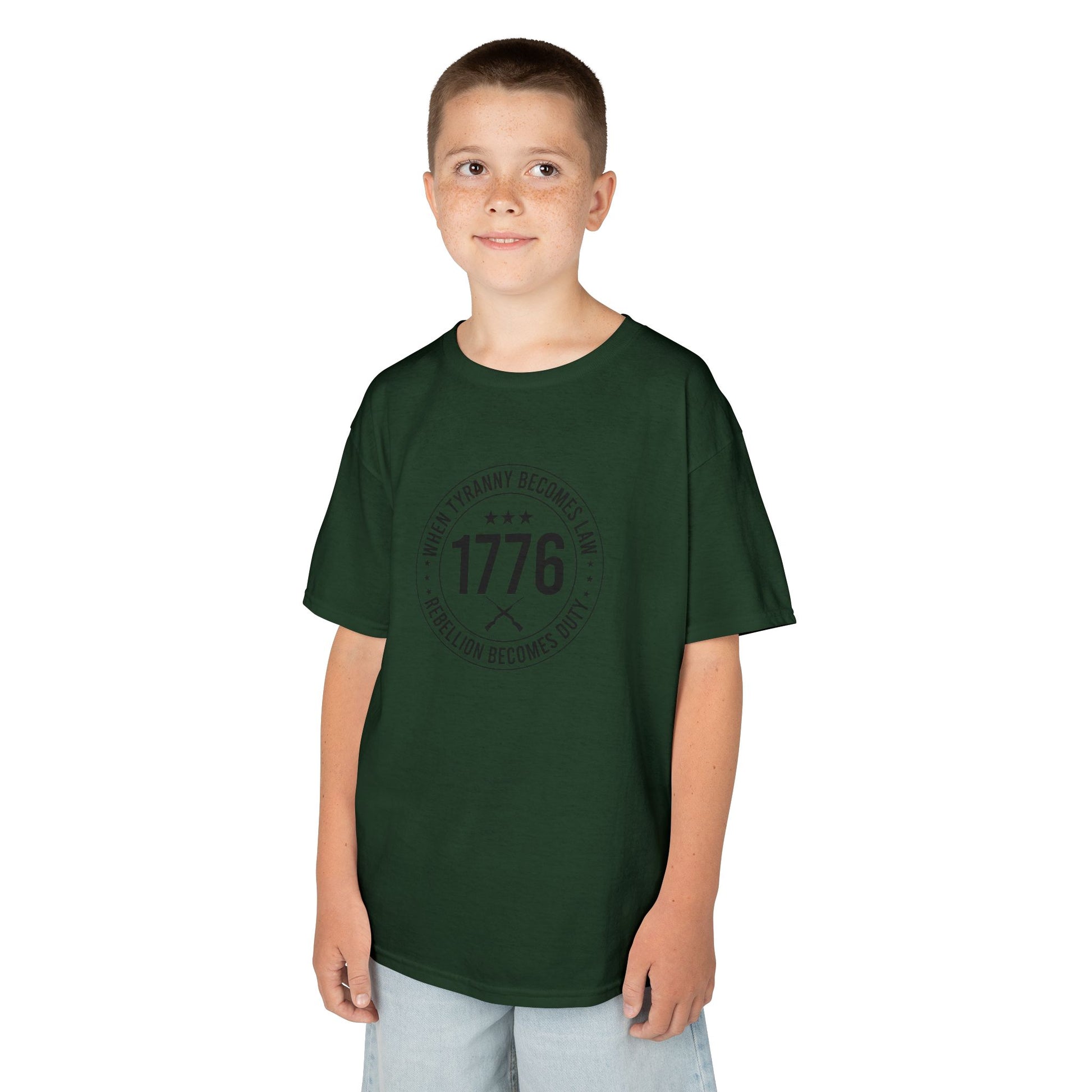 Child wearing a green t-shirt with text on a white background
