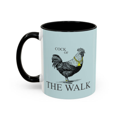 Mug with a rooster illustration and 'Cock of the Walk' text on a light blue background