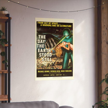 Vintage movie poster for 'The Day the Earth Stood Still' on a wall in a room with plants and a shelf.