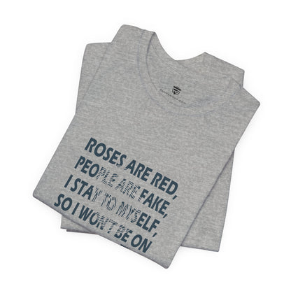 Folded gray t-shirt with printed text on a white background