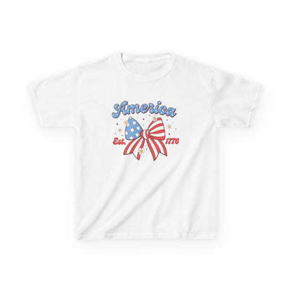 White t-shirt with 'America Est. 1776' design featuring an American flag on a white background
