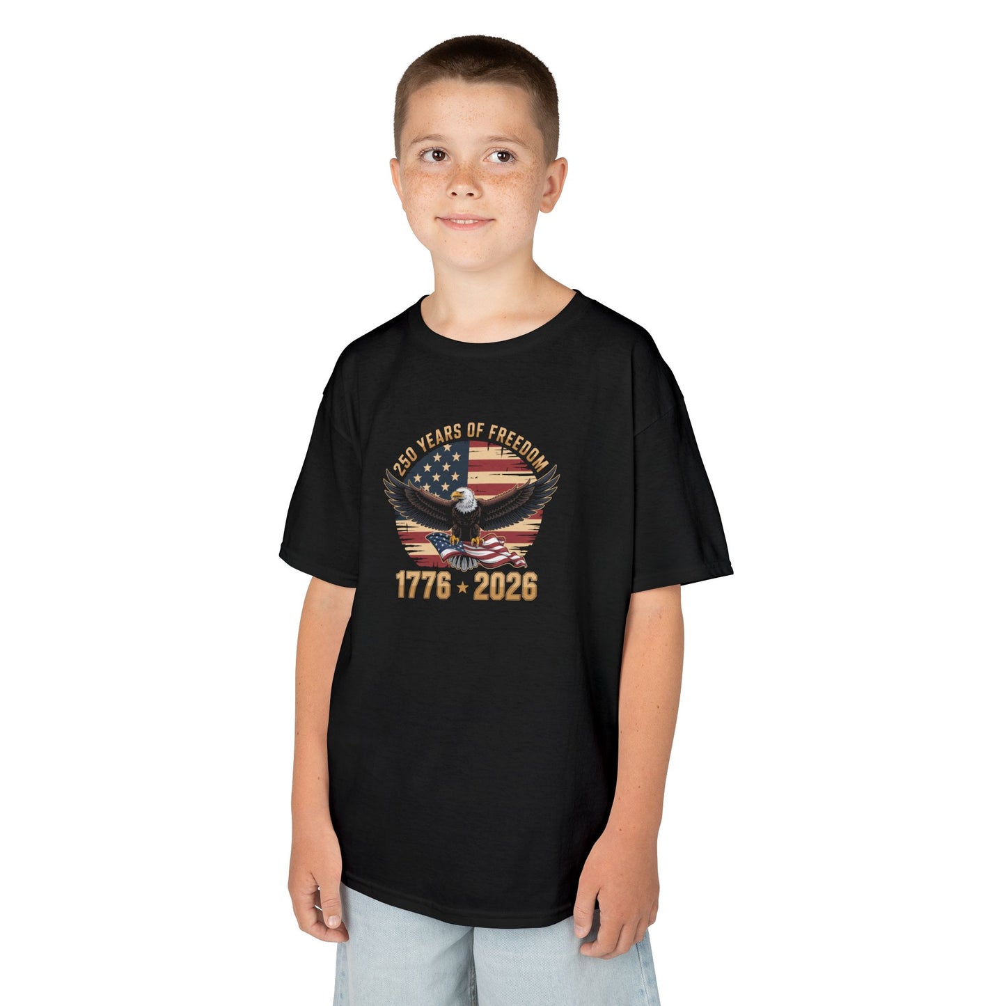 Child wearing a black t-shirt with a graphic design on a white background