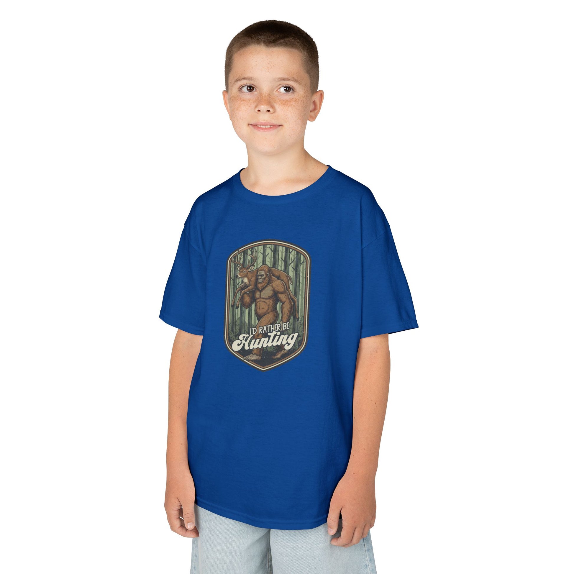 Child wearing a blue t-shirt a bigfoot design and text on a white background