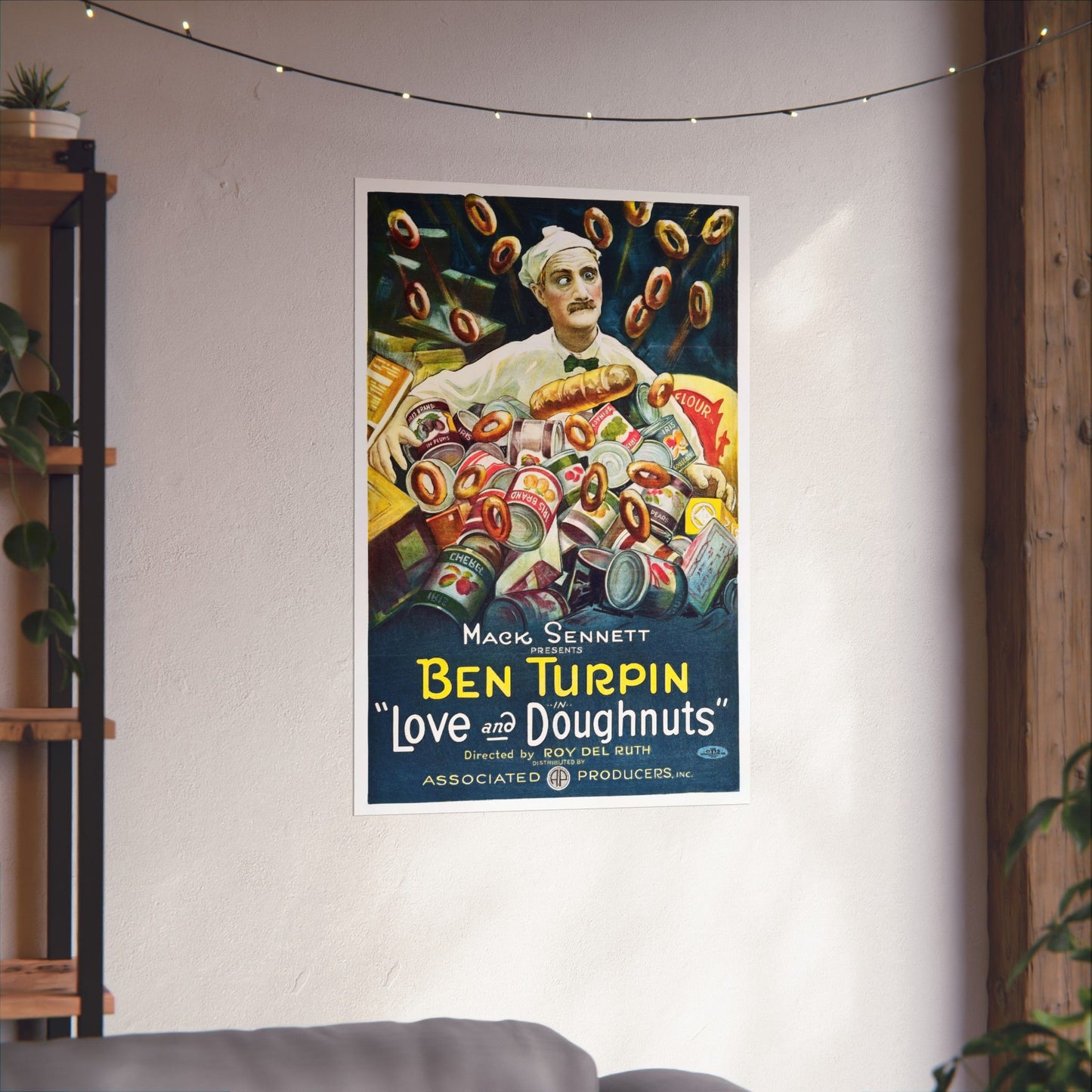 Vintage-style poster of Ben Turpin with doughnuts on a wall in a room.