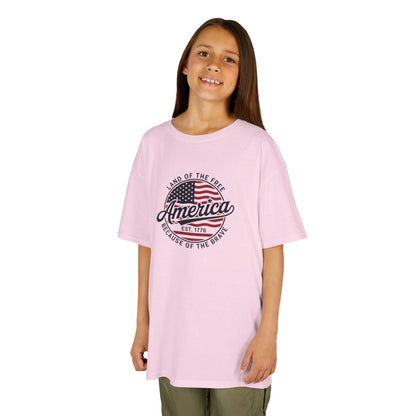 Young girl wearing a pink t-shirt on a white background