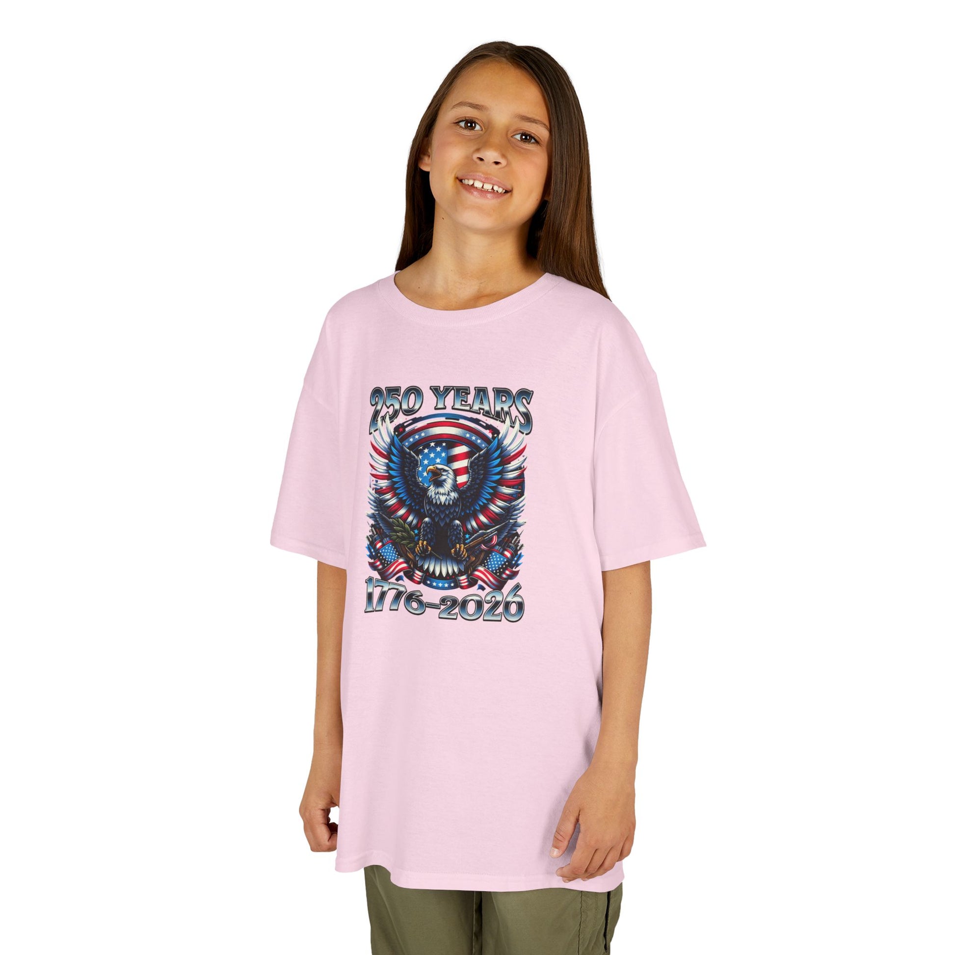 Girl wearing a pink t-shirt with a graphic design on a white background