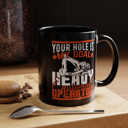 Black mug with humorous design on a wooden surface with coffee beans and a macaron.